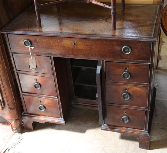 A George III mahogany kneehole desk, W.2ft 10in. D.1ft 7in. H.2ft 6in.(-)